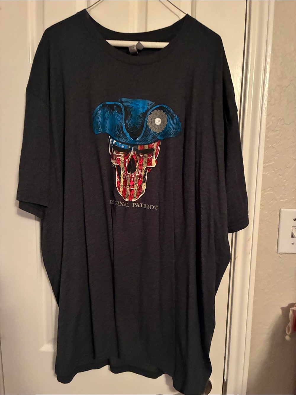 Next Level Apparel Men’s Dark Gray Tee with Blue Hat & Red Striped Skull